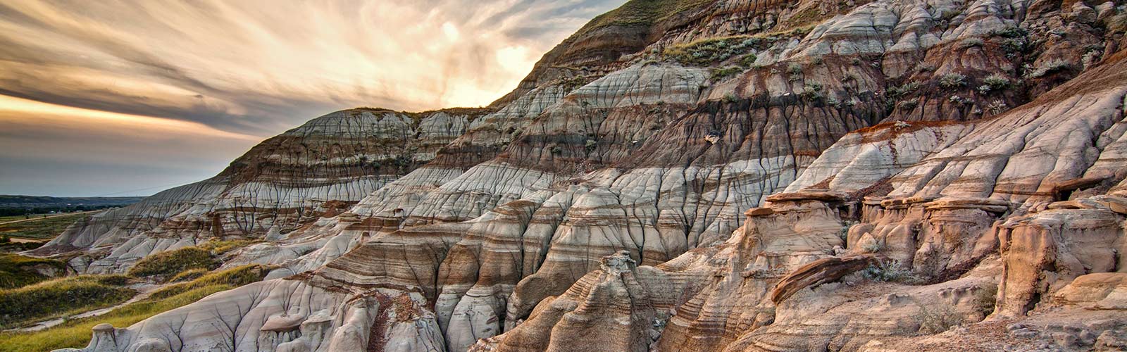 Sun rising over the large rock formations at Dinosaur Provincial Park