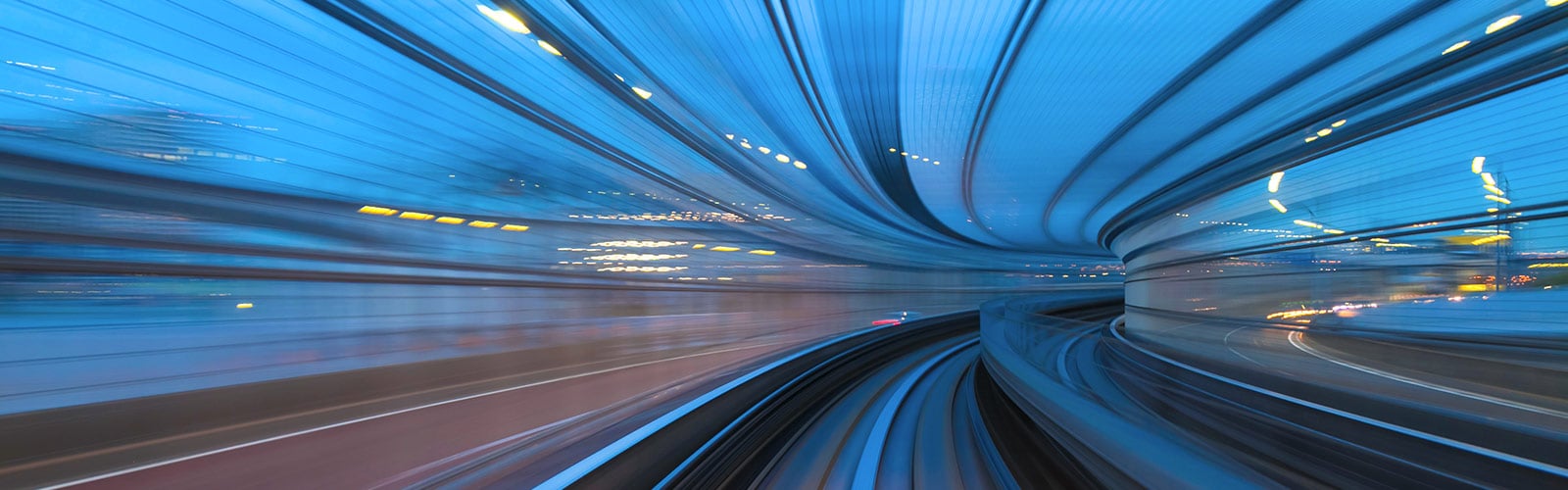 blurred lights capturing motion through a tunnel at high speed